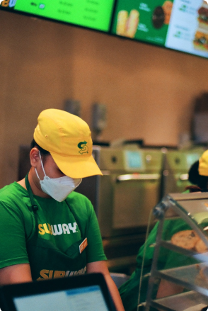 Image of a subway employee